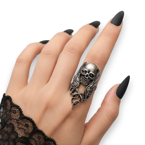 woman wearing Silver Winged Skull Serpent Ring with antique silver skull, wings, and serpent detail ring sizes 9 10 11