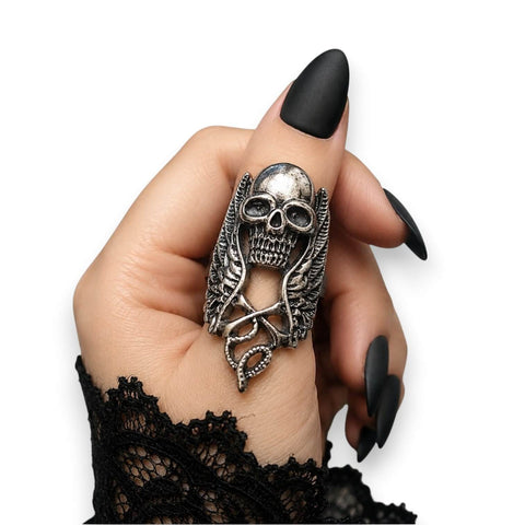 woman wearing as thumb ring Silver Winged Skull Serpent Ring with antique silver skull, wings, and serpent detail ring sizes 9 10 11