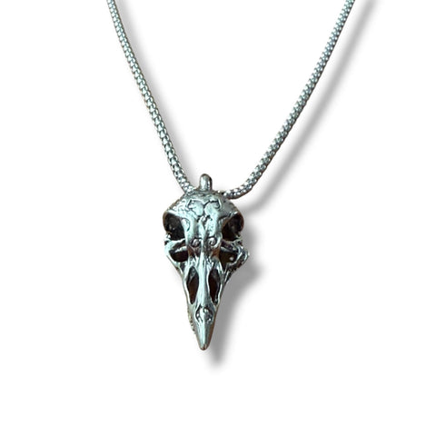 frontal view flat lay silver raven skull pendant necklace stainless steel box chain crow box chain 22"
