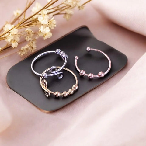 Stackable beaded open rings in silver, gold, copper, and rose gold with spinning fidget beads and open adjustable band design
