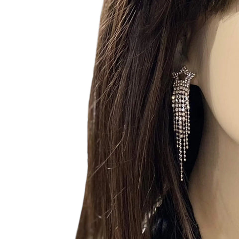 Silver Star Sparkle Long Tassel Earrings worn white background