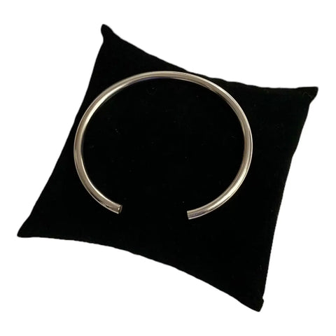open cuff design Sterling Silver Smooth Open Bangle on black velvet pillow 