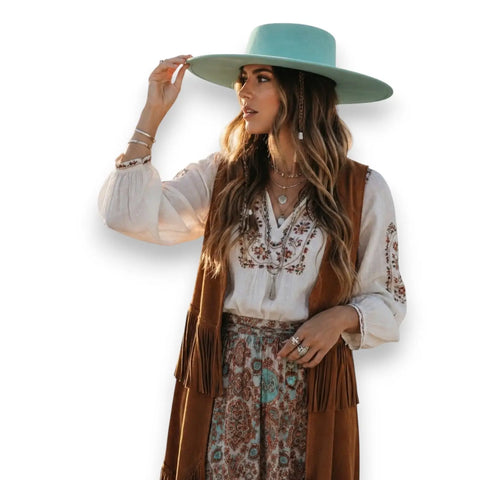 Stylish Round Crown Wide Brim Fedora showcased by a woman wearing a bohemian outfit in natural light.