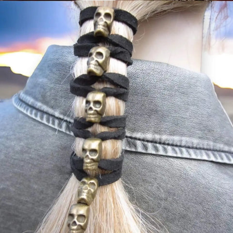 ponytail wrapped with suede skull hair tie
