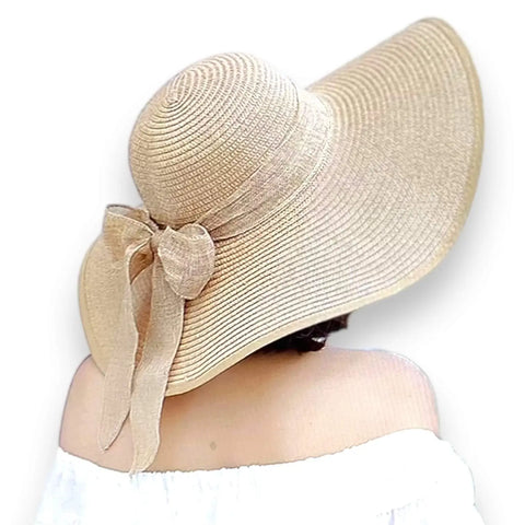 Summer wide brim straw sun hat with linen bow and UPF 50+ protection, perfect for boho chic beach style.