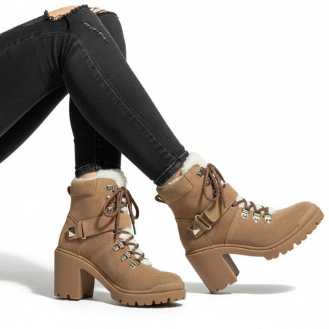 Chunky 3.5-inch heeled lug sole on tan suede sherpa-trimmed ankle boot