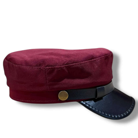 Two Tone Cotton Flat Top Fisherman Cap black faux leather curved brim, and gold button band burgundy