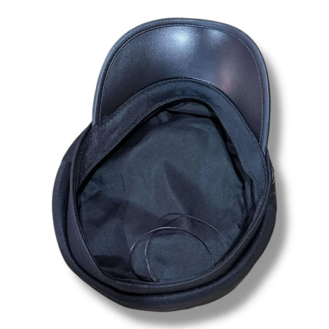 Two Tone Cotton Flat Top Fisherman Cap black faux leather curved brim, and gold button band upside down black.