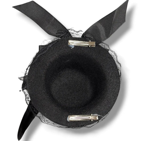 Black mini top hat fascinator with rooster feathers, lace, fishnet veil, satin bow and skull card detail