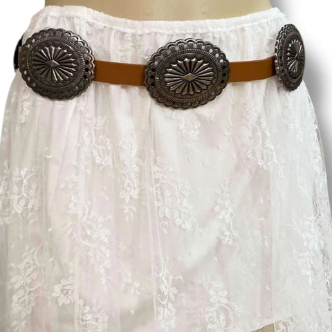 tan Western Leather Silver Concho Buckle Belt on white floral lace skirt