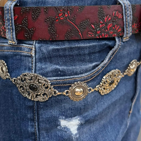 Western Goth Red Western Textured Cross Buckle Belt with glossy floral strap and ornate silver engraved cross buckle