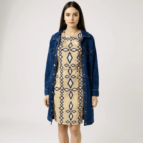 Western Tribal Shift Mini Dress with Gold Tassel Belt tan with blue/white aztec print, keyhole neckline, detachable braided chain belt, lined shift model wearing with denim duster