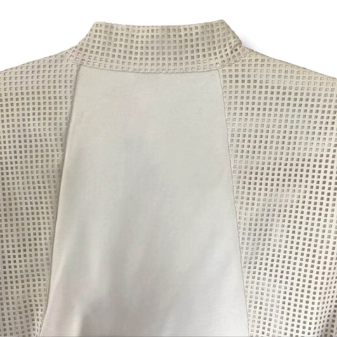 White Faux Leather Perforated Jacket with crisscross open front, collarless neckline, and long textured sleeves back panel neckline 