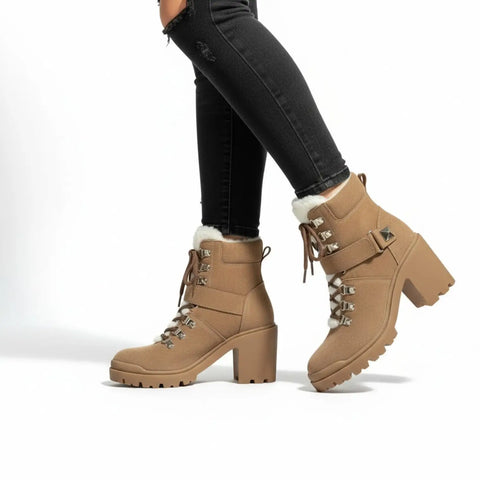 Tan suede leather heeled boots with white sherpa tongues, silver D-ring laces and chunky lug soles