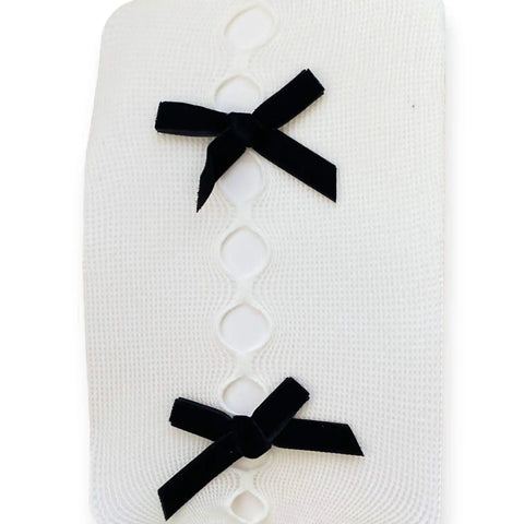 Women's Cut Out Bow Fishnet Tights with small-diamond mesh; off-white, black, and white with black velvet bows
