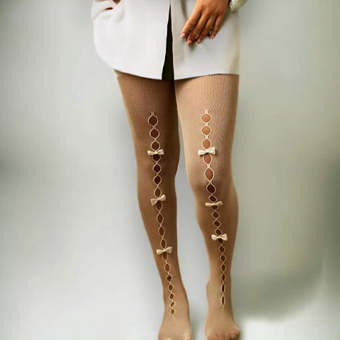 Women's Cut Out Bow Fishnet Tights with small-diamond mesh; off-white, black, and white with black velvet bows