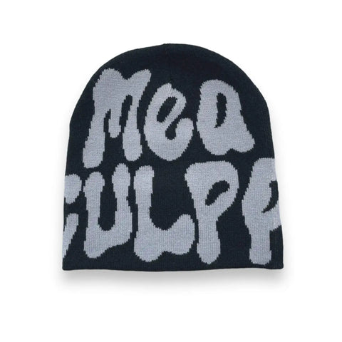 Unisex knit beanie with bold “Mea Culpa” graphic in black and white, styled as winter streetwear hat for Y2K fashion.