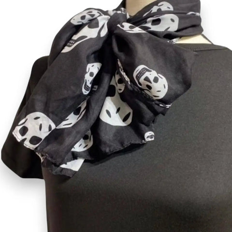 Lightweight long skull print scarf in black and white with allover pattern and multi-way wrap styling