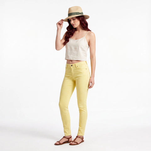 woman wearings pair Yellow Low Rise Skinny Jeans with organic cotton stretch and Y2K streetwear style / 30x 31 or 31 x 31 / Monkee Genes