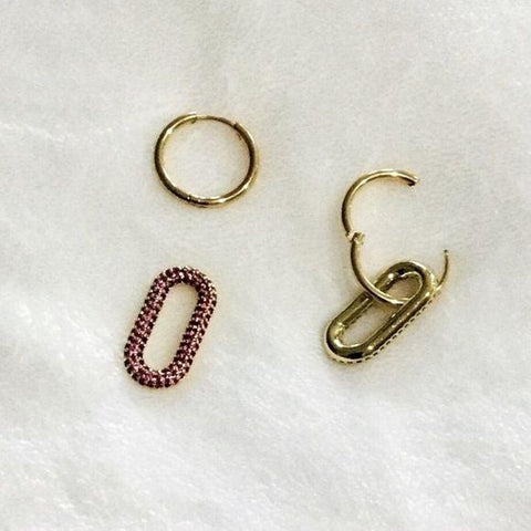 flat lay of front and back click open hoop front and back side of oval links