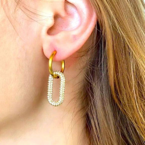 side view click-top closure on gold hoop earrings