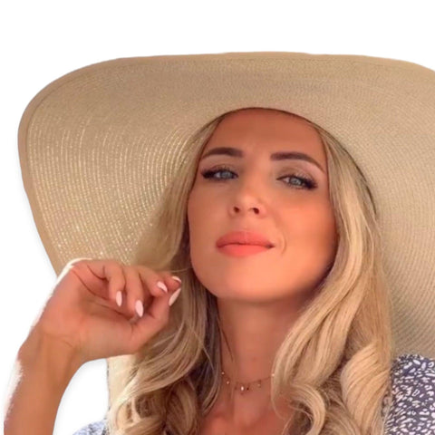 Summer wide brim straw sun hat with linen bow and UPF 50+ protection, perfect for boho chic beach style.