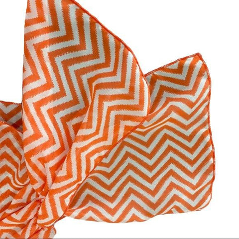 Off shoulder scoop neck striped top with orange and white chevron pattern, cold shoulder straps, bowknot draped sleeves, and front flowing overlay